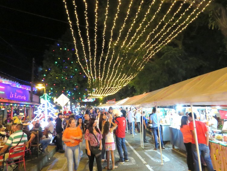Christmas lights in Sabaneta with booths selling food and drinks
